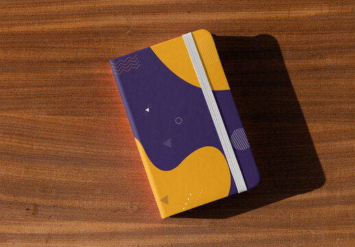 Customizable Notebook Cover with elastic band on Wooden Surface