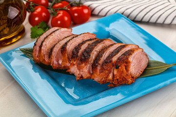 Sliced duck breast baked with cherry