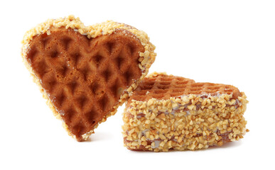 Heart-shaped waffle coated in crushed nuts makes a delightful treat for dessert lovers
