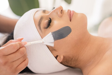 Facial mask getting applied to womans face