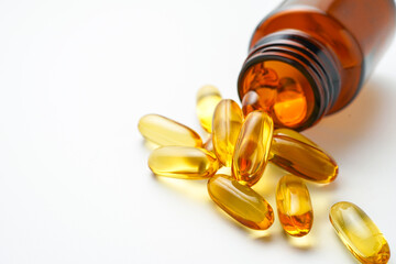 Vitamin capsules in a bottle, soft gels, Fish oil capsules, omega 3, omega 9, vitamin D, vitamin E