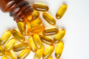 Vitamin capsules in a bottle, soft gels, Fish oil capsules, omega 3, omega 9, vitamin D, vitamin E