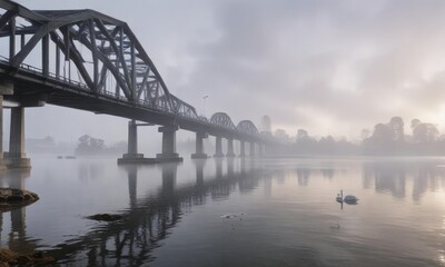 Fototapeta premium Foggy morning at Fremantle road bridge with mist rising from swan river, road, Fremantle, morning
