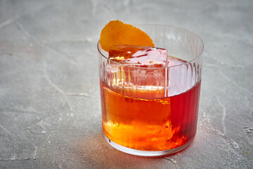 A classic Negroni cocktail, served on the rocks with an orange peel garnish