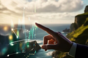 A hand pointing at a digital graph with fluctuating lines and data on a transparent screen. The background shows a scenic coastal view with the ocean and green cliffs under a cloudy sky.