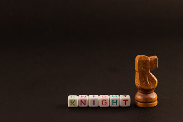 A majestic chess king stands tall, its presence commanding attention. The word 