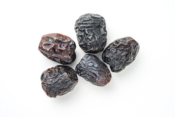 Dates fruit ajwa or kurma ajwa, isolated on white background