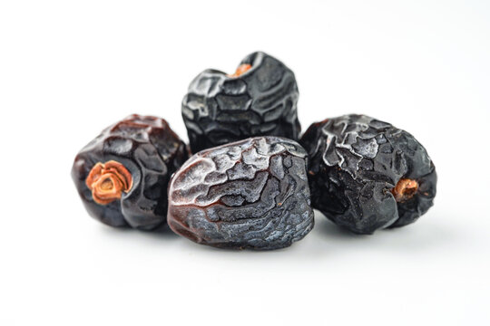 Dates fruit ajwa or kurma ajwa, isolated on white background