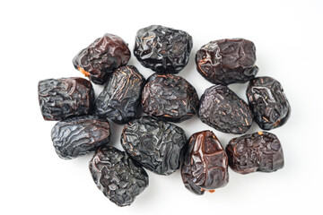Dates fruit ajwa or kurma ajwa, isolated on white background