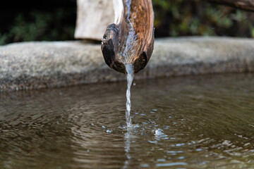 wooden fountain in the Buddhist temple
