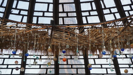 Beautiful lamp hanging on the ceiling with a natural background