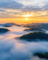 Obraz premium breathtaking sunrise over misty mountains, creating serene landscape