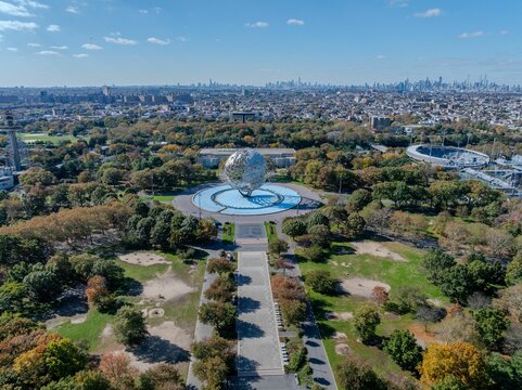 Aerial view of The Unisphere surrounded by greenery in Flushing Meadows Park.