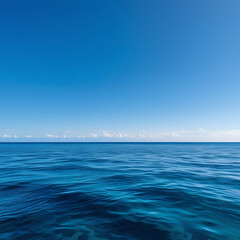 Obraz premium Immerse yourself in the timeless beauty of the ocean under a clear sky. This stunning image captures the deep blue waters stretching endlessly to the horizon