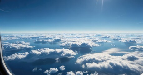 Naklejka premium View of a vast blue ocean from an airplane window , clear horizon, aerial perspective