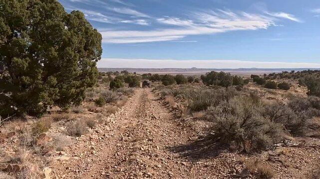 Recreation road mountain desert forest follow UTV Utah P. Off road trail riding in 4x4 all terrain vehicle for sport and recreation. Desert landscape, dusty trails and recreation areas. Southwest Utah