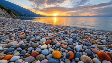 Obraz premium Colorful Stones Beach Sunset Mountain View