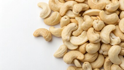 Fototapeta premium A bunch of fresh cashews in the right side, white blank area in the left side, isolated background