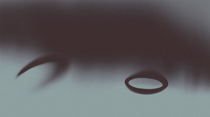 Shadowy silhouette of a suspended object against blurred background against blurred background