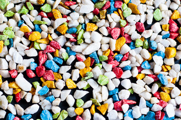 Colored stone background on black background