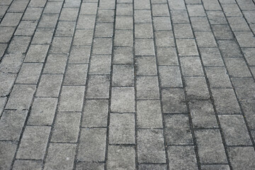 Perspective block pavement or herringbone brick tile floor walkway. Perspective concrete block pavement. City sidewalk block or the pattern of stone block paving.
