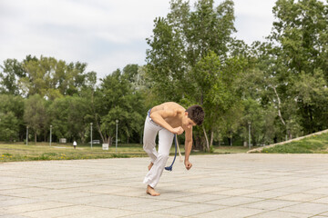Teenager practicing capoeira , brazilian martial art