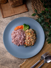 Jasmine Red Cargo Rice with Stir-Fried Basil Chicken. Pad-kaprao, Thai food.