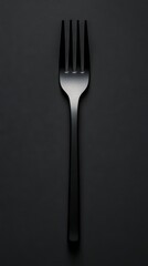 Black Fork on a Dark Background: A Minimalist Still Life