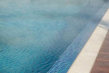 Obraz premium Detail of hotel outdoor pool with hot mineral water vapors