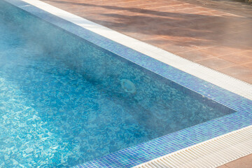 Obraz premium Detail of modern outdoor swimming pool in luxury hotel