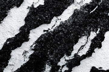 Grungy, abstract texture with overlapping layers of black and white. The image should have a chaotic and energetic vibe.