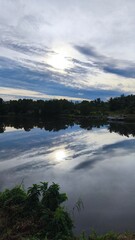 Beautiful Cloud Reflections on a Tranquil Lake in Phuket, Thailand