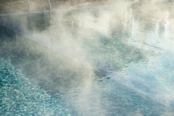 Detail of hotel outdoor pool with hot mineral water vapors