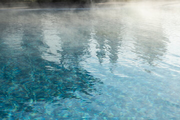 Detail of hotel outdoor pool with hot mineral water vapors