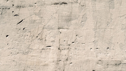 texture old concrete wall with remains of paint with damages