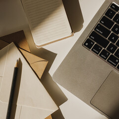 Modern Desk Setup with Stationery, Notebook and Laptop. Warm Tones and Natural Light. Inspiring...