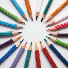 Fototapeta premium Colorful pencils in a circular arrangement on white background, showcasing vibrant hues for art and creativity.