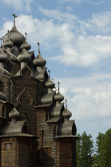 Historical wooden church made of logs in Bogoslovka