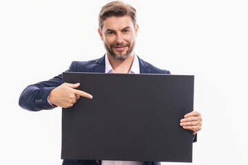 Middle aged man with blank placard. Demonstrating copy space for your text or design. Man showing empty advertisement board on studio background. Blank placard, signboard for ad.