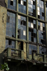 Broken windows of an abandoned old factory building