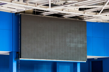 Large LED screen scoreboard of a large sports arena © PhotOleh