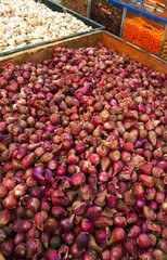 Piles of red onion baskets in the market. Semarang-Central Java. 01-06-2025