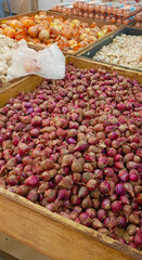 Piles of red onion baskets in the market. Semarang-Central Java. 01-06-2025