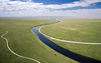 Obraz premium River winding through a wide open plain