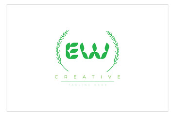EW letters eco logo with leaf. Fresh nature and healthy leaf logo design.