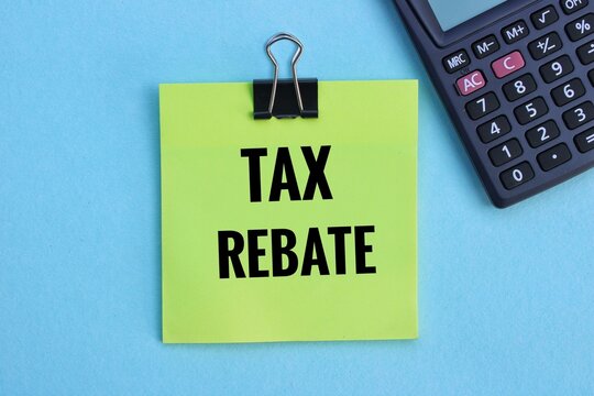 TAX REBATE concept on paper with calculator.  TAX REBATE concept.