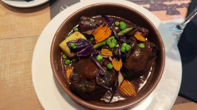 itional Spanish oxtail stew with potatoes, slow cooked meat in red wine sauce in Bilbao Spain. High quality 4k footage