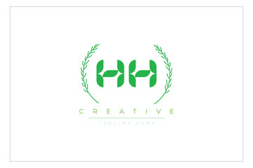 HH letters eco logo with leaf. Fresh nature and healthy leaf logo design.