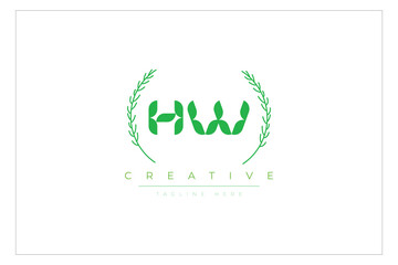 HW letters eco logo with leaf. Fresh nature and healthy leaf logo design.