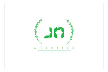 JN letters eco logo with leaf. Fresh nature and healthy leaf logo design.